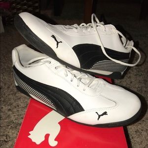 White and black gym style pumas. Barely worn